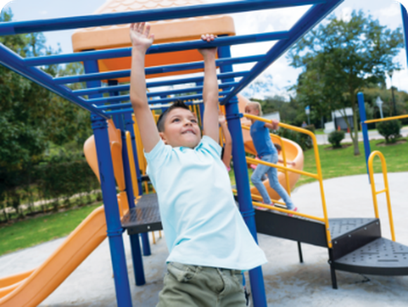 Boy on monkey bars